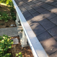 Close-up view of durable gutter leaf guards installed by Call The Gutter Guys, designed to prevent debris buildup and ensure smooth water flow
