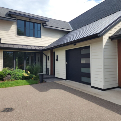 A beautiful luxury home in Minneapolis, Minnesota, showcasing newly installed seamless gutters for enhanced protection and style by a professional gutter company