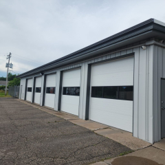 Commercial building featuring durable T-Tone gutters installed by Call The Gutter Guys for superior drainage and protection