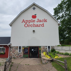 Apple Jack Orchard in Delano, MN, featuring newly installed seamless gutters by Call The Gutter Guys for optimal water management and protection