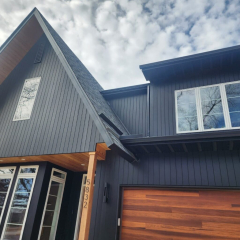 A high-end luxury home featuring expertly installed seamless gutters, enhancing both functionality and curb appeal by call the gutter guys