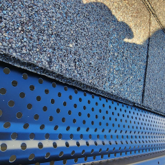 Roof line view of black gutter leaf protection made by EZ Flow and installed professionally by Call The Gutter Guys