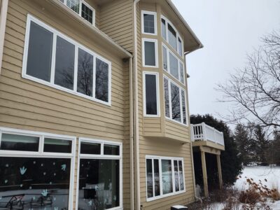 5 inch seamless gutters on tan house in Maple Grove