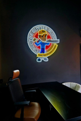 Call The Gutter Guys office with desk, leather chair, gray visitor chairs and LED light gutter guy logo