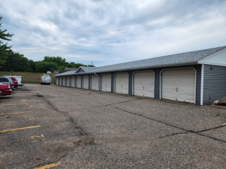 Spacious garage with seamless gutters installed along the roofline for effective water drainage