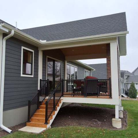 Antique Parchment colored seamless gutters on screen porch in Delano Minnesota