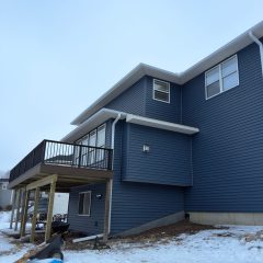 White seamless gutters installed by Call The Gutter Guys in Rockford Minnesota in 2026