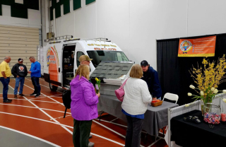 Call The Gutter Guys expo booth at the Rockford MN community business expo meeting people